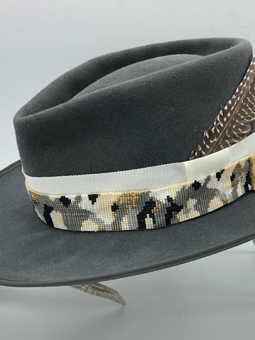 JW BENNETT Western Hat with hand beaded camo band and hawk pin.  7 3/8